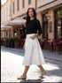 The pleated denim skirt
